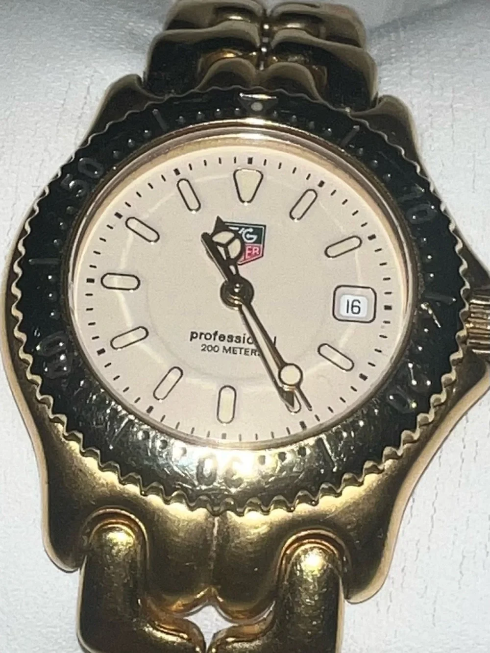 Tag Heuer Gold Tone Watch with Cream Dial and Black Bezel Accents 28mm
